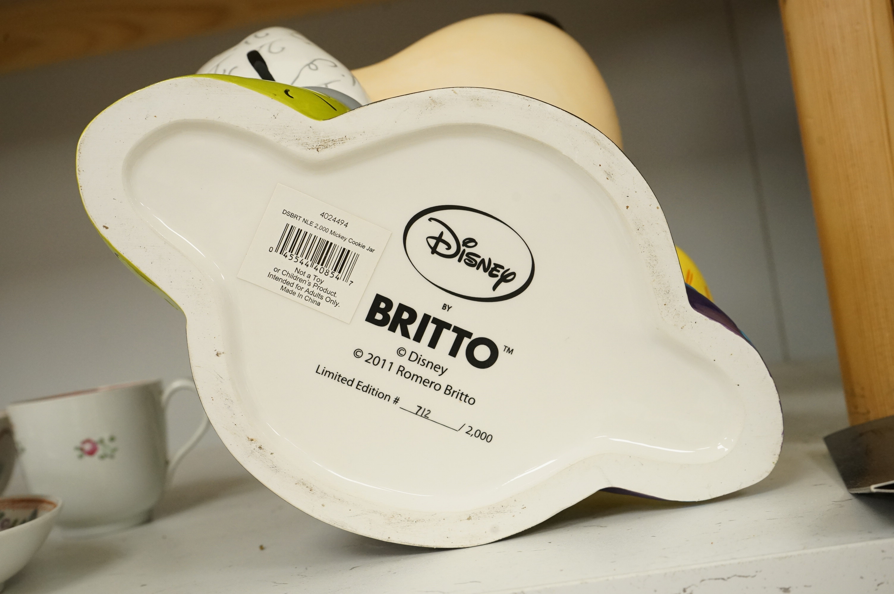 Romero Brotto (Brazilian, 1963-), a ceramic Mickey Mouse cookie jar with booklet, lacking cover, 21cm high